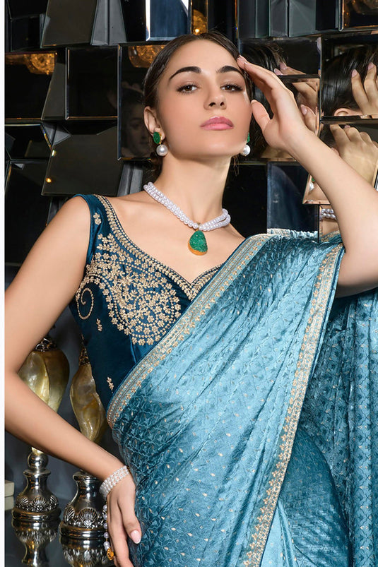Radiant Embroidered Work On Cyan Color Silk Fabric Saree