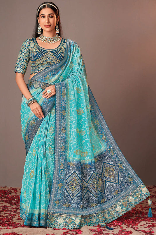 Soothing Silk Saree With Heavy Embroidered Velvet Blouse In Cyan Color