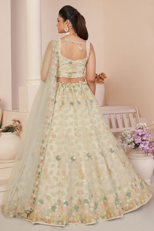 Fashionable Beige Color Embroidered Designs Net Fabric Lehenga