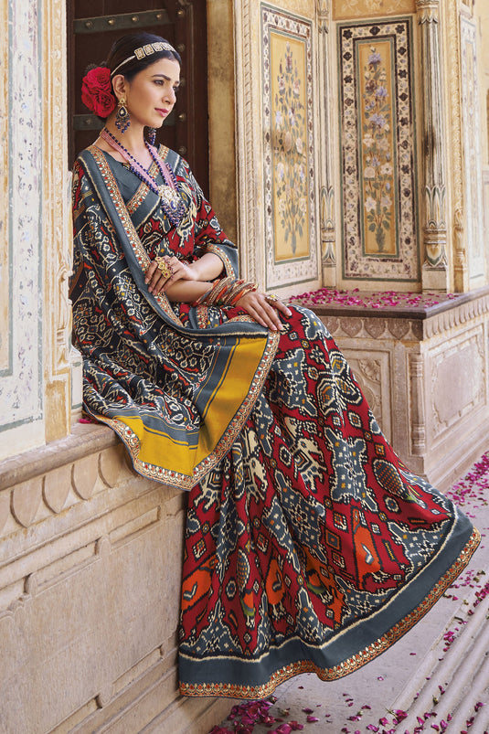 Imposing Printed Patola Silk Saree In Grey Color