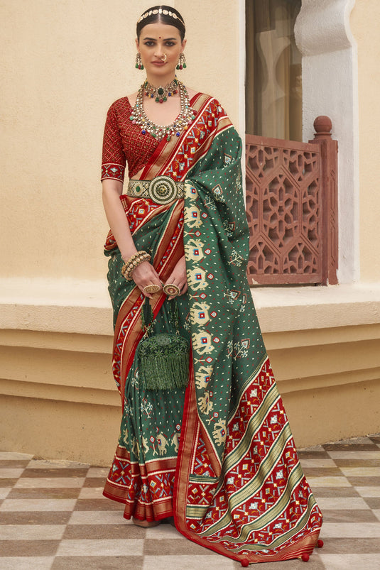 Attractive Dark Green Printed Patola Silk Traditional Saree