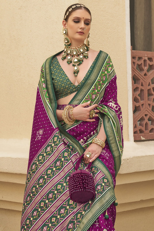 Delightful Purple Printed Patola Silk Function Wear Saree