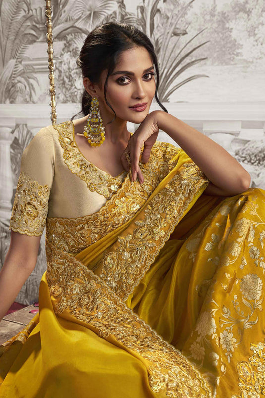 Appealing Heavy Embroidery Work Fancy Fabric Yellow Color Saree With Party Look Blouse