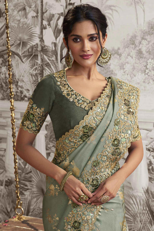 Heavy Embroidery Work Creative Sea Green Color Fancy Fabric Saree With Party Look Blouse