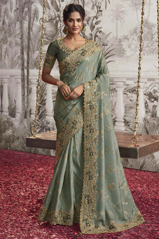 Heavy Embroidery Work Creative Sea Green Color Fancy Fabric Saree With Party Look Blouse