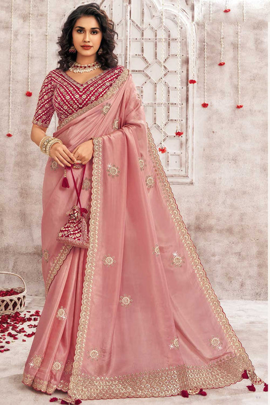 Engaging Peach Color Organza Saree With Border Work