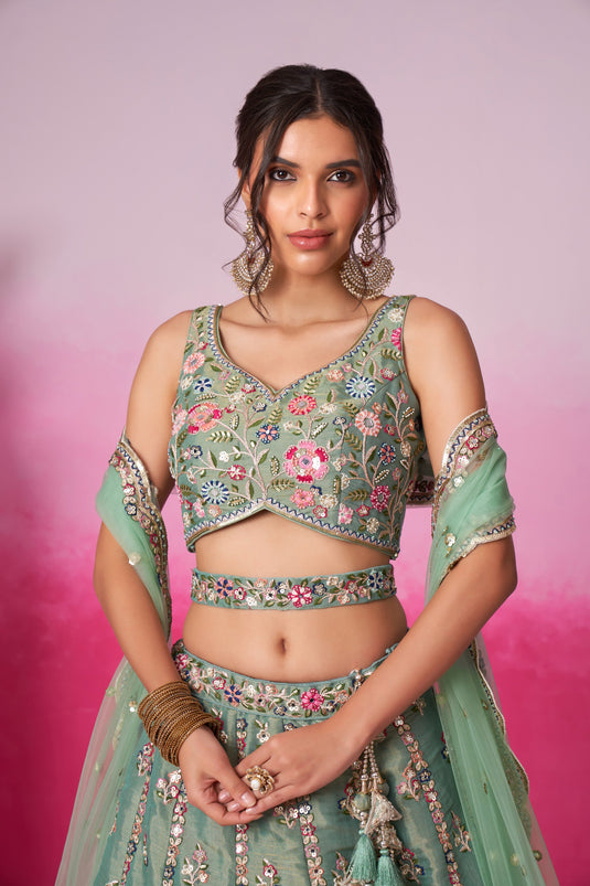 Sea Green Sequins Work Net Fabric Reception Wear Lehenga With Enchanting Blouse