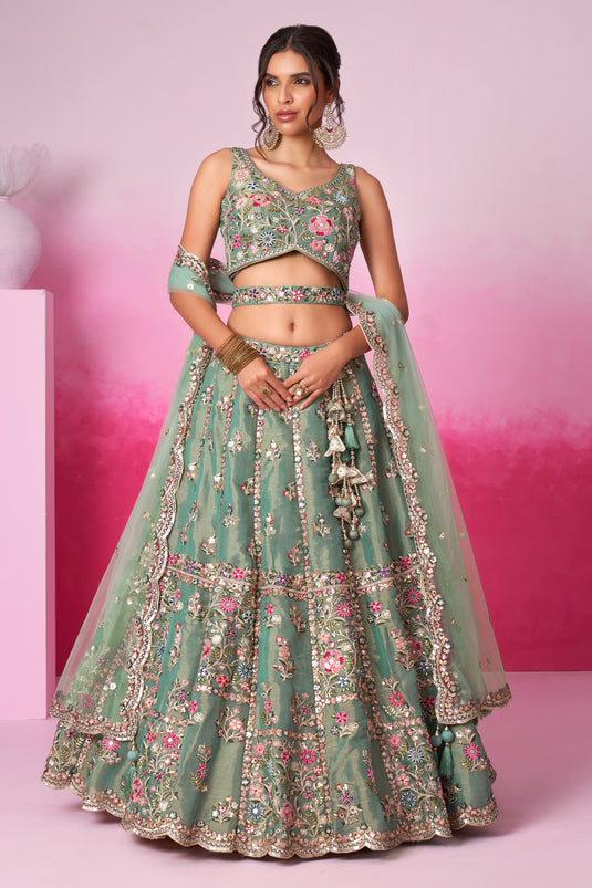 Sea Green Sequins Work Net Fabric Reception Wear Lehenga With Enchanting Blouse