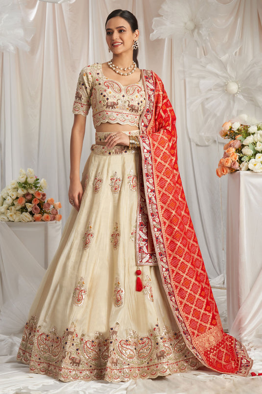 Flawless Tissue Thread Embroidery Cream And Red Lehenga Choli