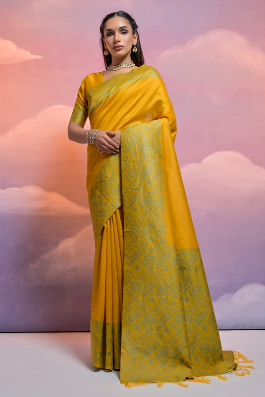 Delightful Yellow Color Weaving Border Work Handloom Raw Silk Function Wear Saree