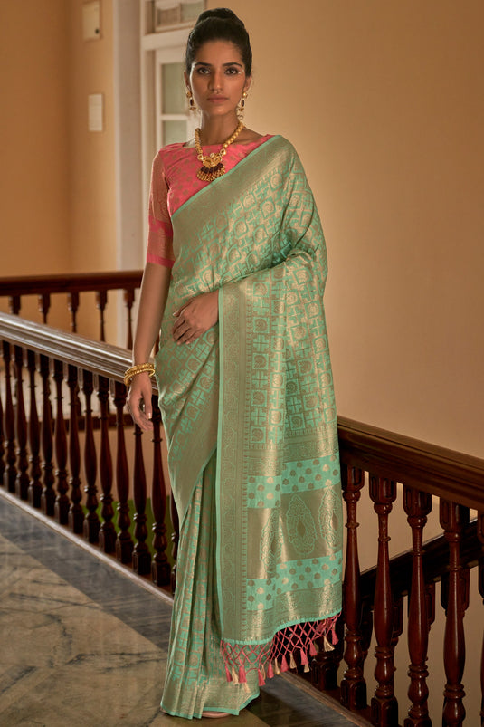 Appealing Weaving Work On Crepe Silk Fabric Saree In Sea Green Color