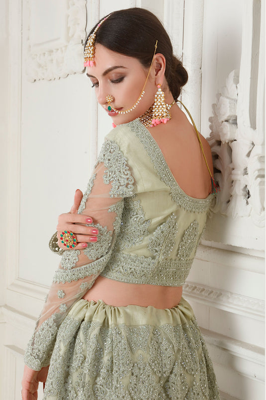 Embroidery Work On Sea Green Color Sober Lehenga In Net Fabric