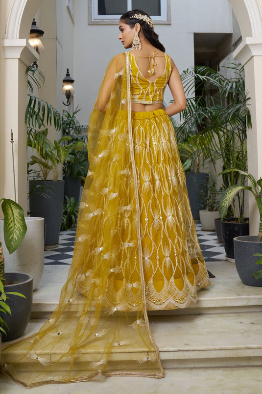 Stylish Mustard Color Net Fabric Sequins Embroidered Lehenga