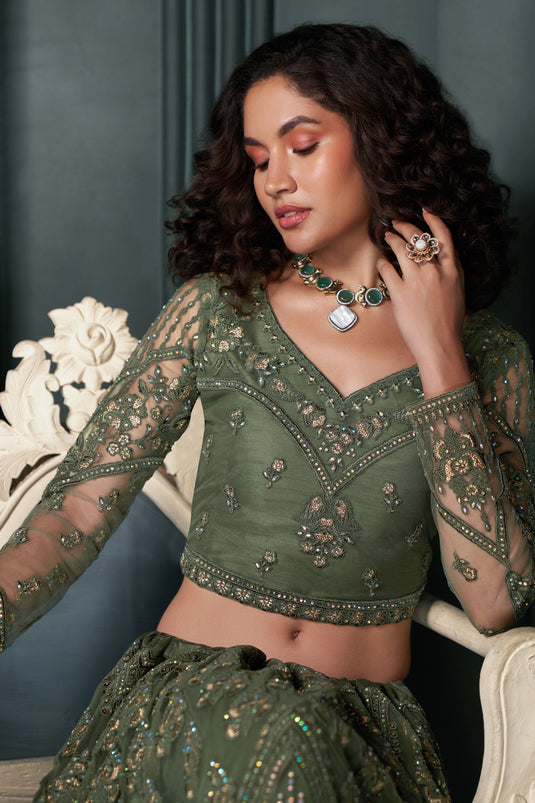 Soothing Embroidered Work On Mehendi Green Color Net Fabric Lehenga