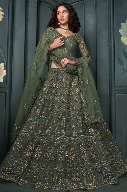 Soothing Embroidered Work On Mehendi Green Color Net Fabric Lehenga