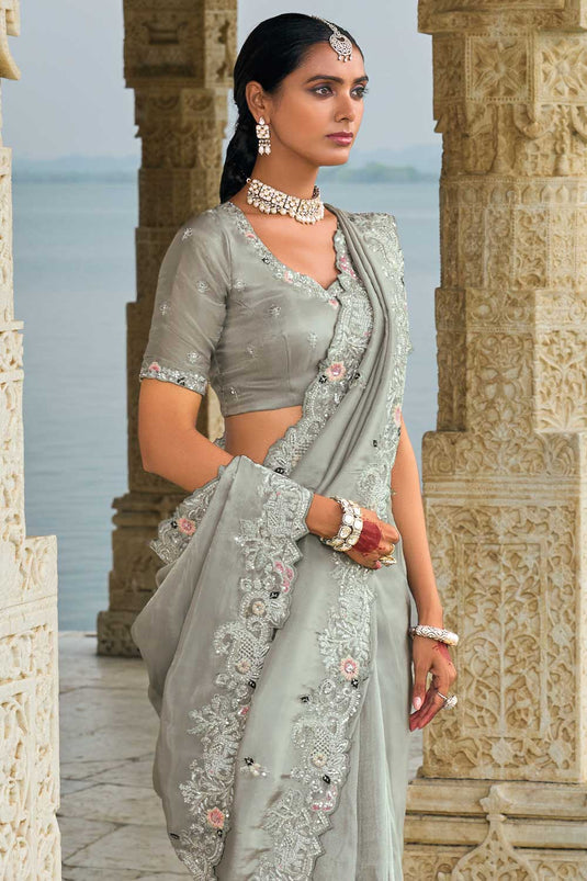 Banarasi Fabric Heavy Embroidered Work Mesmeric Saree In Grey Color