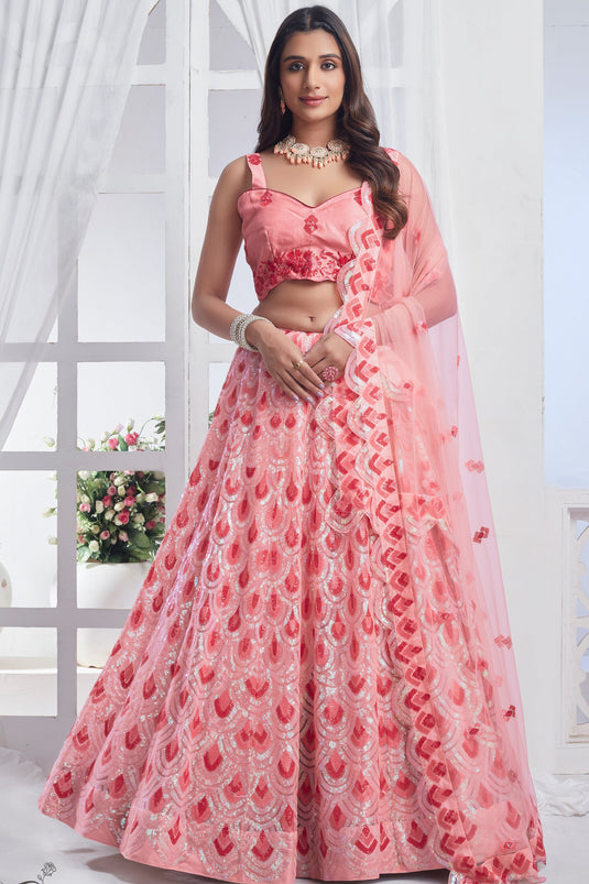 Fashionable Peach Color Sequins Work Net Fabric Lehenga