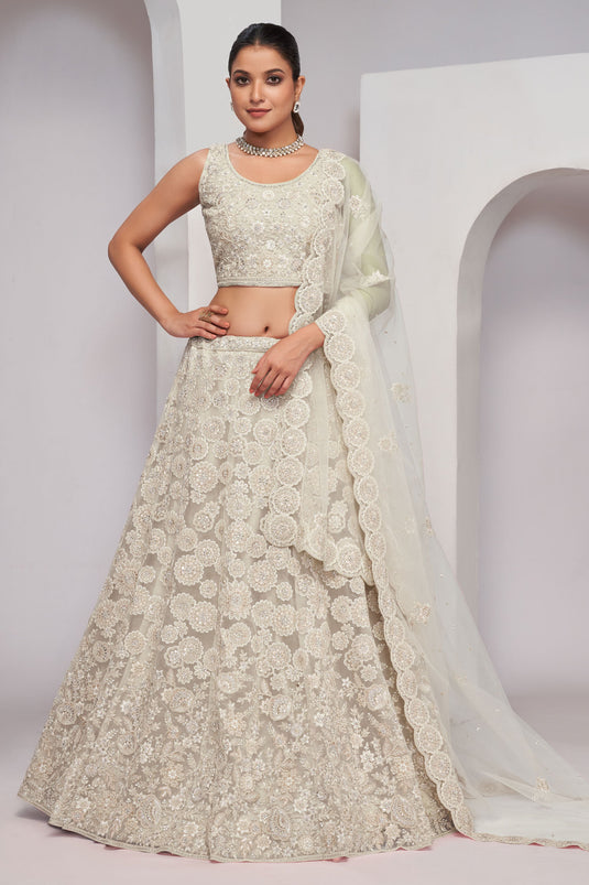 Creative Sequins Work On Beige Color Net Fabric Lehenga