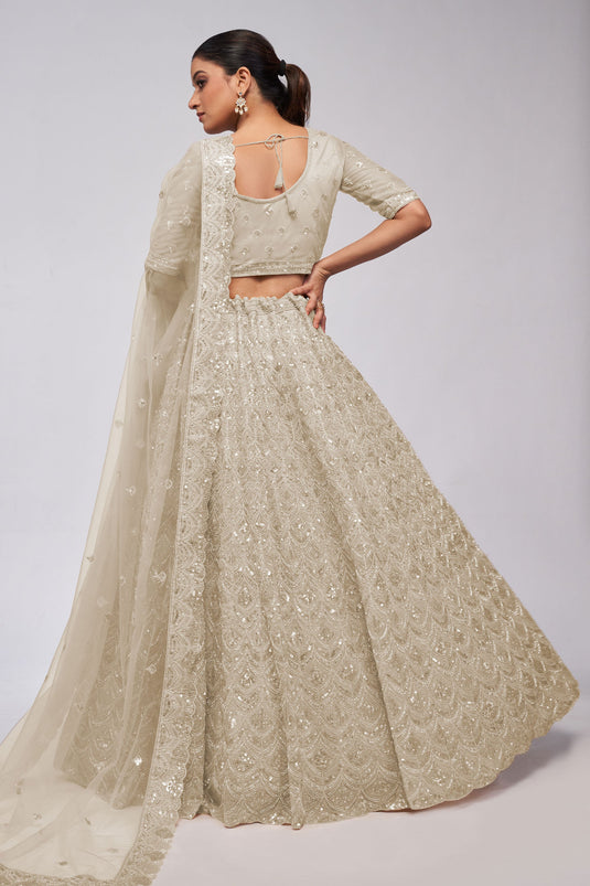 Engaging Off White Color Net Fabric Lehenga With Sequins Work