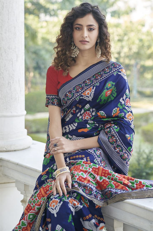 Art Silk Fabric Sangeet Wear Weaving Work Patola Style Saree In Navy Blue Color