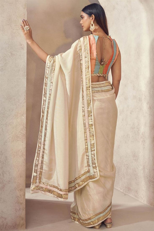 Exclusive Beige Color Silk Fabric Hand Embroidered Sangeet Wear Readymade Saree