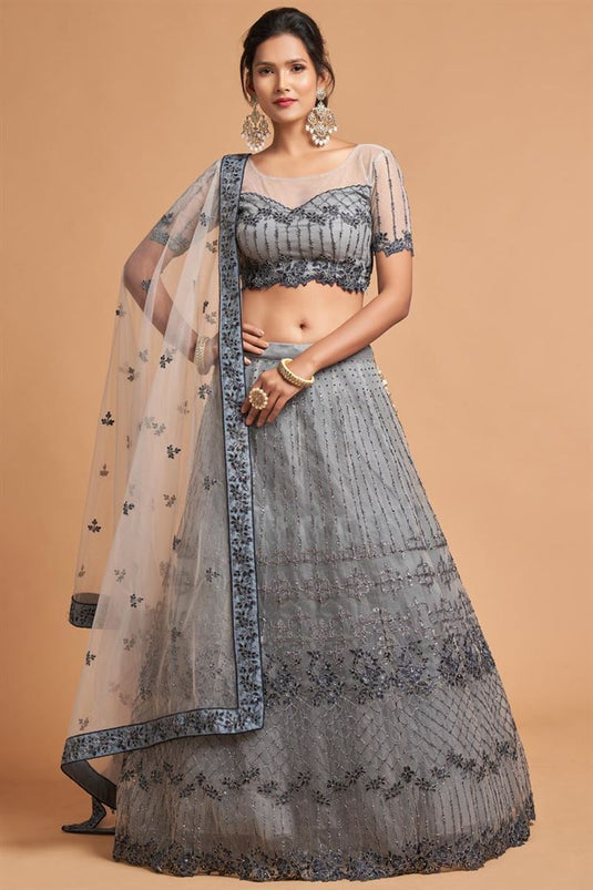 Grey Color Net Fabric Sangeet Wear Precious Lehenga With Embroidered Work