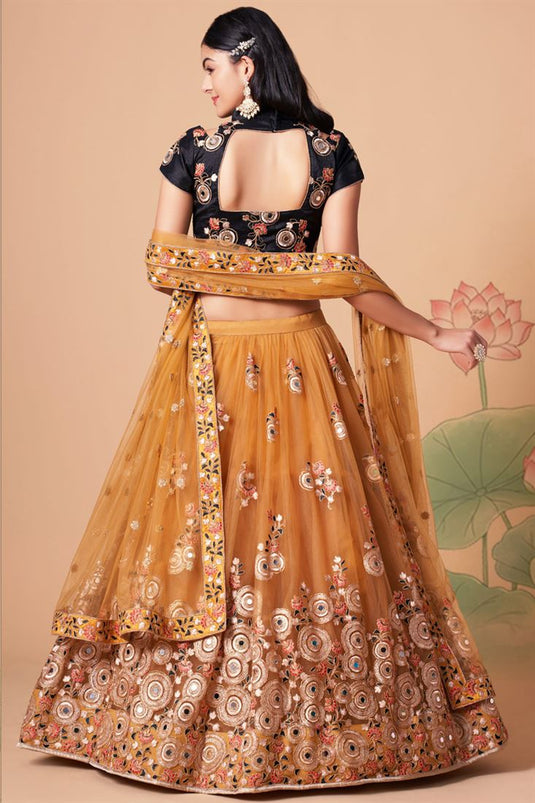 Mesmeric Golden Color Sangeet Wear Lehenga Choli In Net Fabric