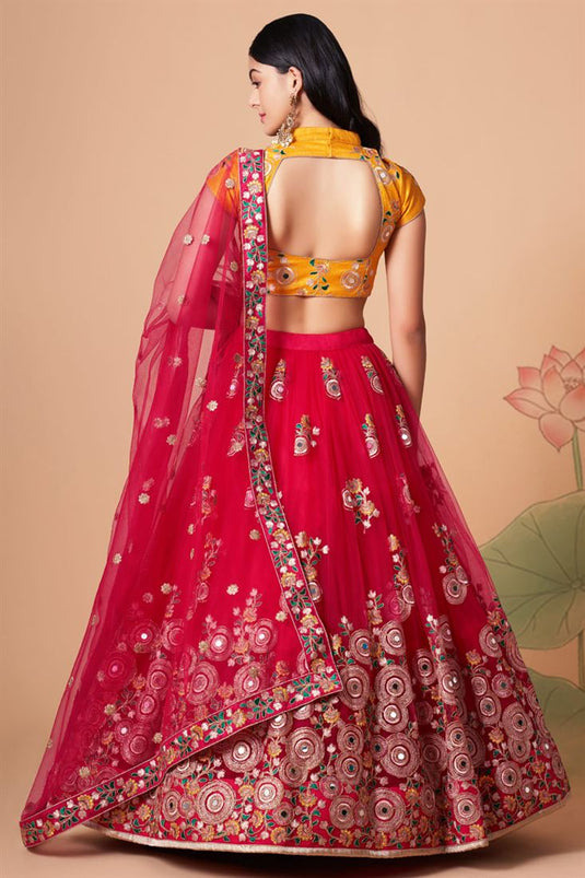 Incredible Sangeet Wear Net Fabric Rani Color Lehenga Choli