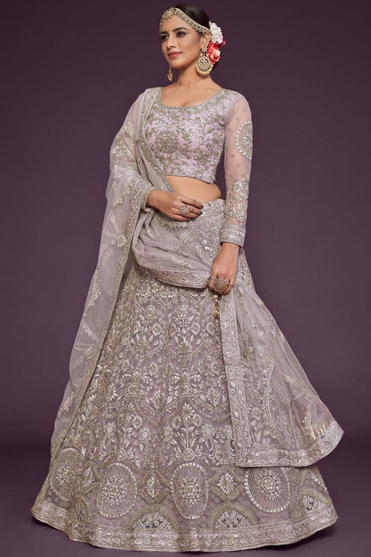 Embroidered Work On Cream Color Gorgeous Lehenga In Net Fabric