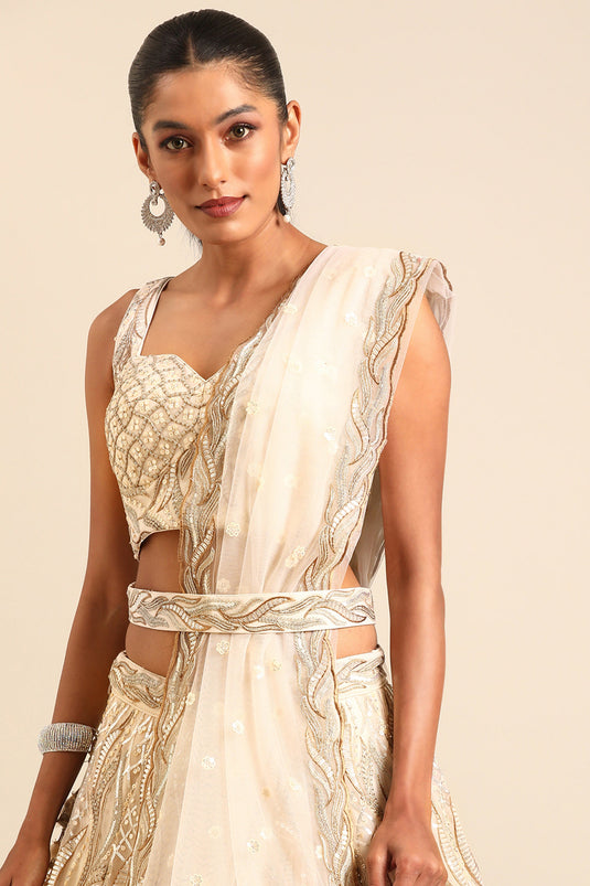Occasion Wear Sequins Work Lehenga Choli In Cream Net Fabric
