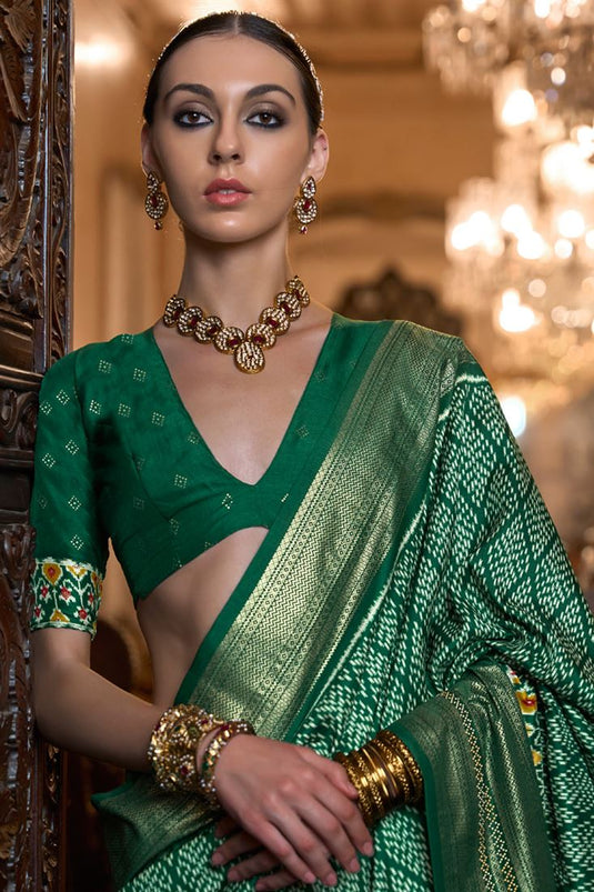 Gorgeous Patola Silk Dark Green Color Printed Saree