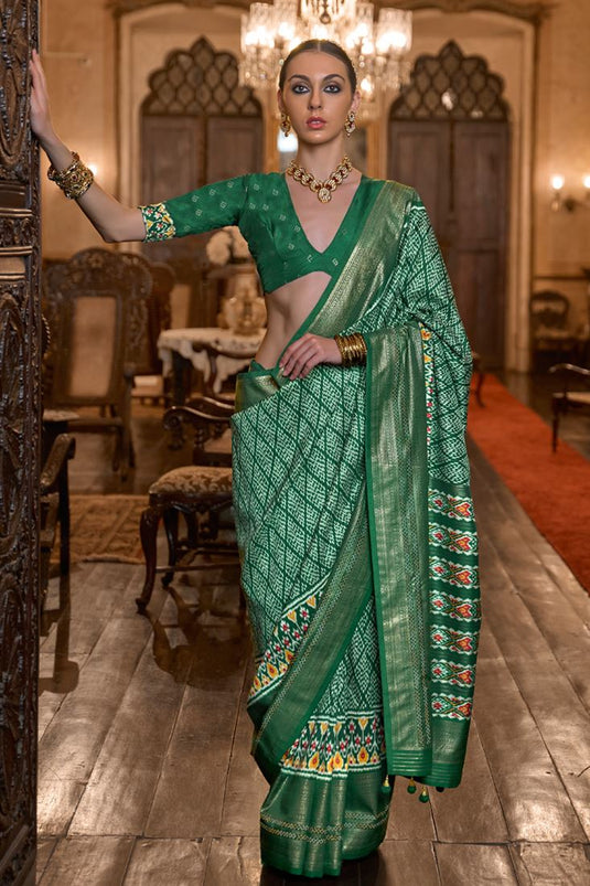 Gorgeous Patola Silk Dark Green Color Printed Saree