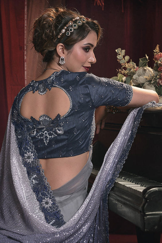 Appealing Heavy Embroidery Work Net Grey Color Saree With Party Look Blouse