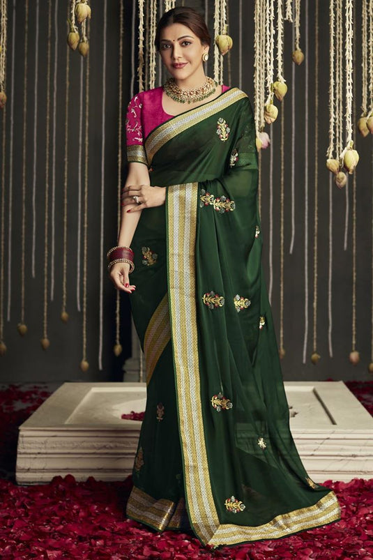 Beguiling Border Work On Dark Green Color Crepe Fabric Kajal Aggarwal Saree