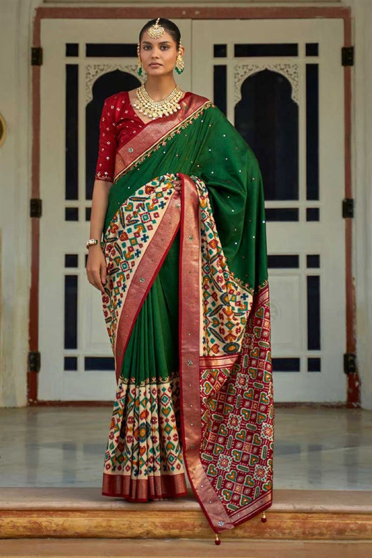 Appealing Patola Printed Art Silk Fabric Saree In Dark Green Color