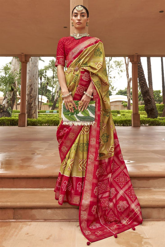 Captivating Art Silk Fabric Mustard Color Patola Printed Saree