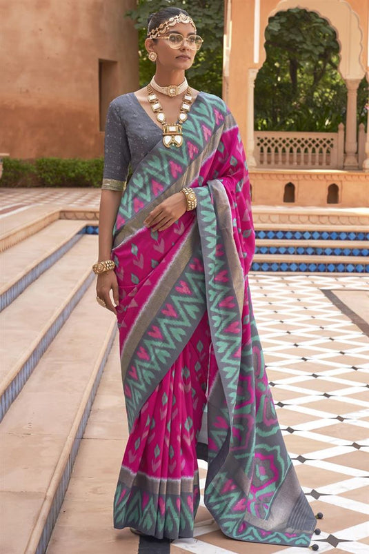 Tempting Art Silk Fabric Rani Color Patola Saree With Printed Work