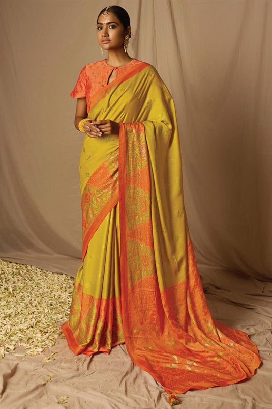 Brasso Fabric Mustard Color Delicate Saree With Weaving Work