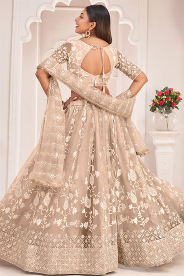 Ingenious Net Fabric Embroidered Lehenga In Chikoo Color