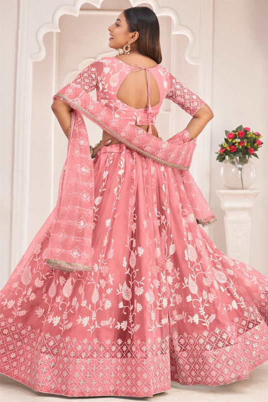 Captivating Peach Color Net Fabric Embroidered Lehenga