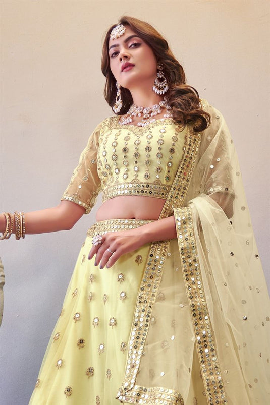 Net Fabric Sequins Work Luminous Lehenga In Cream Color